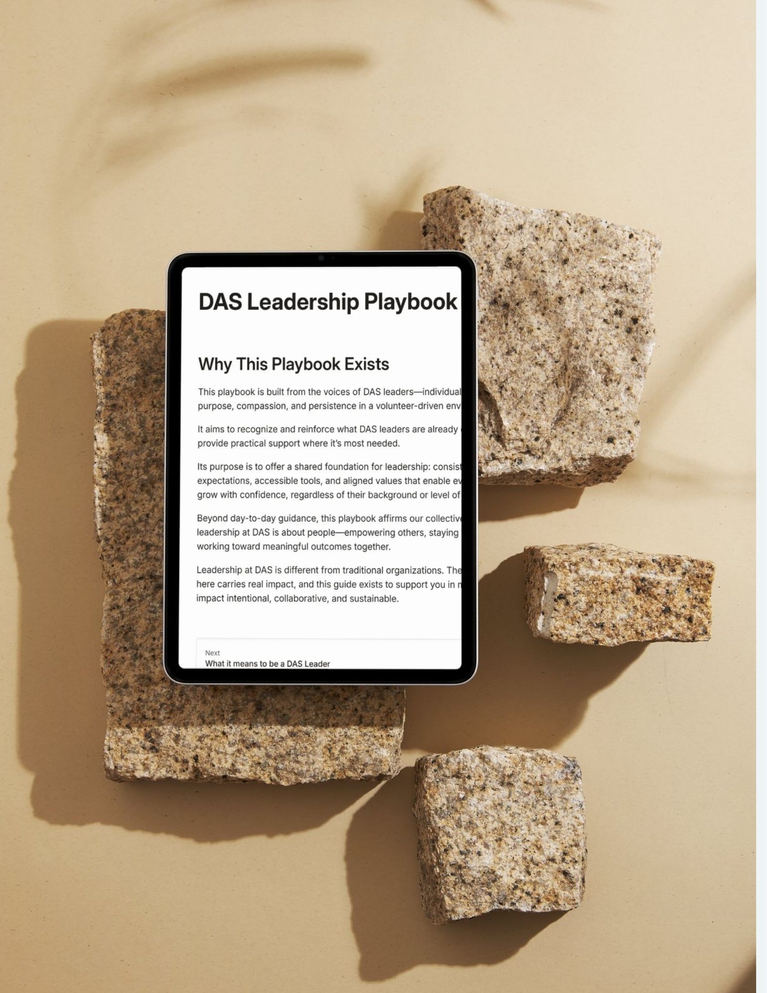 A render of three white cylindrical columns, against a warm creme background
